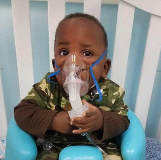 Patches pediatric, small boy receiving mechanical ventilation